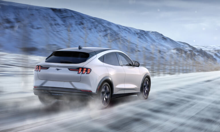 2023 Ford Mustang Mach-E driving on a snowy road