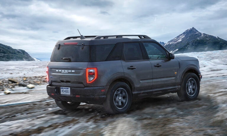 2024 Ford Bronco driving in icy mountain range