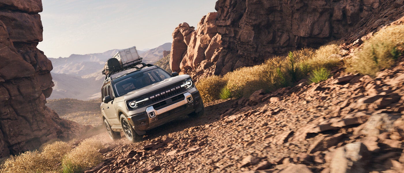 2026 Ford Bronco Sport driving up rocky path with luggage