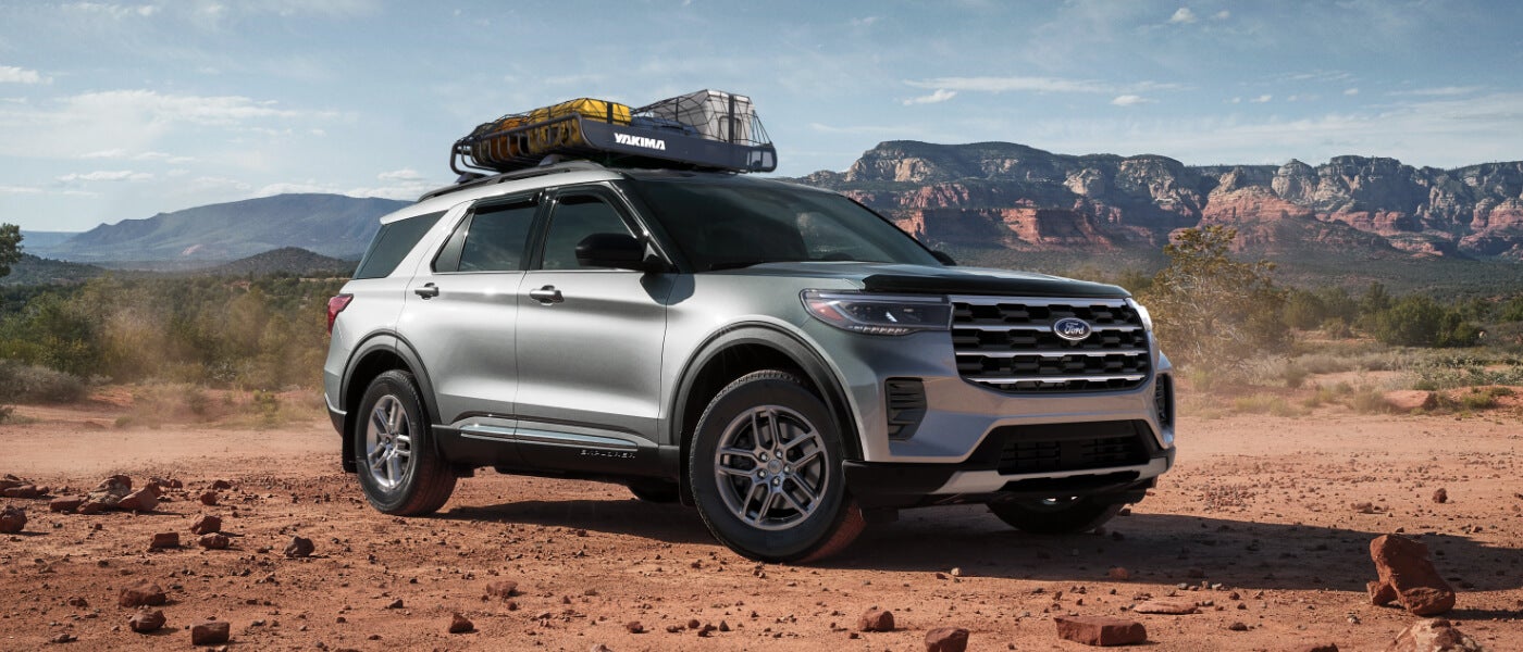 2026 Ford Explorer parked in desert with luggage
